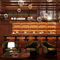 Modern Lounge Interior With Wooden Walls Circular Pendant Lights Bar Counter And Green Armchairs