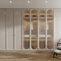 Modern Walk in Closet Interior With White Cabinets Glass Doors and Wooden Flooring