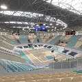 Modern Indoor Sports Fitness Arena Featuring Basketball Court Green Seats And Stands