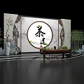 Traditional Tea Ceremony Setting With Circular Calligraphy Backdrop Bamboo Rockery And Wooden Table