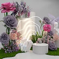 Floral Installation with Pink Purple Flowers White Columns Neon Light Statue and Green Grass Base