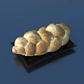 Freshly Baked Braided Bread on Black Plate with Golden Crust Fluffy Texture