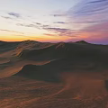 Beautiful Desert Landscape At Sunset With Rolling Sand Dunes And Colorful Sky