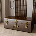 Brown Leather Trunk With Golden Clasps And Bamboo Screen In Interior Decor