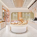 Dessert Shop Interior Design With Glass Display Cases Fresh Pastries And Round Counter