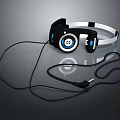Black And Blue Over Ear Computer Headphones With Circular Earpads And Cable Design