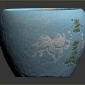 Succulent Plant In Blue Ceramic Pot With Fish And Seaweed Patterns And Small Pebbles