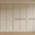 Modern Light Colored Wardrobe With Paneled Doors And Metal Handles In Minimalist Bedroom Interior