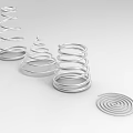Playground Equipment With Silver Metal Spiral Structures In Various Shapes