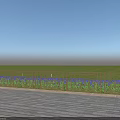 Ornate Metal Railings Along Wooden Floor With Blue Flowers And Green Grassland Under Blue Sky