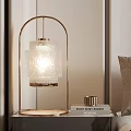 Illuminated Table Lamp With Gold Frame And White Textured Lampshade On Modern Bedroom Bedside Table