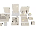 Elegant Jewelry Display With Necklaces Bracelets Rings And Earrings Arranged On Stands