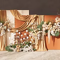Commercial Event Decoration Equipment Featuring Floral Arrangements Golden Curtains and Orange Backdrops