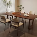 Wooden Dining Table with Beige Cushioned Chairs Vase Plants and Fruit Platter in Light Room