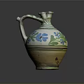 Traditional Ceramic Jug With Green And Blue Floral Patterns And Curved Handle