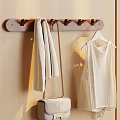 Wooden Coat Rack With Hanging Scarf Bag And White Dress On Wall