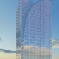 Modern Tall Office Building With Glass Curtain Wall Against Blue Sky Background