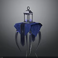Elegant Decorative Lantern On Blue Patterned Tablecloth With Ornate Metal Legs
