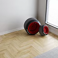 Two Large And Small Tires With Red Rims Marked SF-23 On Wooden Floor White Wall