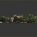 Traditional Yellow Building With Red Roof Surrounded By Green Trees And Lawn