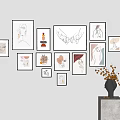 Multiple Abstract Paintings On Wall With Various Frames And Vase With Dried Flowers 3d model