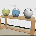 Three Colorful Spherical Table Lamps Yellow Blue White Lit on Wooden Table