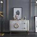 Elegant Modern Entryway Console Table With White Cabinet Gold Accents Artwork And Decorative Items