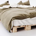 Wooden Pallet Bed Frame With Green Bedspread And White Pillows Setup
