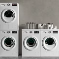 Modern White Washing Machines Stacked And Side By Side With Laundry Detergents And Basket