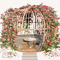 Vines Cover Cage Like Seating Area With Pink Blooms And Table