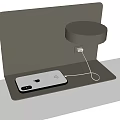 Modern Minimalist Smartphone Charging Stand With Metal Design And Round Lamp