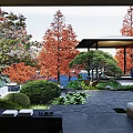 Serene Garden Landscape With Red Green Trees Stone Paving And Pavilion Area