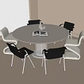 Round White Table with Six White and Black Chairs Open Book Clear Vase Indoor Room