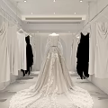 Modern White Wedding Dress Shop Interior With Arched Design And Gowns