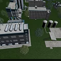 Aerial View Of Industrial Factory Buildings With Storage Tanks And Green Grass