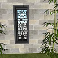 Traditional Chinese Style Entrance Gate With Hollow Out Design On Stone Wall And Bamboo Plants