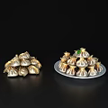 Golden And Silver Dumplings On Plates With Green Garnish And Delicious Look