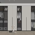 Modern Walk in Closet Interior With Glass Doors Hanging Clothes And Storage Cabinets