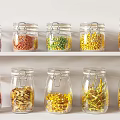Transparent Glass Spice Jars With Colored Spices On White Shelf