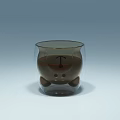 Transparent Cartoon Style Glass Cup with Bear Shaped Base and Brown Liquid Inside
