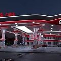 Red and White Canopy Gas Station with Fuel Pumps and Trees Around Vehicles Refueling