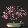 Decorative Pink Flower Tree With Serene Seated Statue On Green Grass