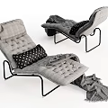 Gray Upholstered Lounge Chair With Black Metal Frame Polka Dot Pillow And Throw Blanket