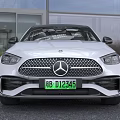 White Mercedes Benz Sedan With Sleek Front Design And Alloy Wheels