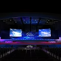 Huawei Conference Stage With Large Screens And Seats In Modern Auditorium