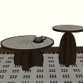 Round Coffee Tables With Patterned Tops And Curved Brown Bases On Geometric Rug