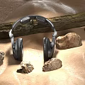 Silver Headphones On Light Colored Background With Wooden Log And Stones