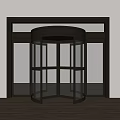 Modern Revolving Door With Brass Frame And Glass Panels In Wooden Entrance Surround
