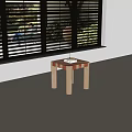 Square Coffee Table Featuring Orange White Checkerboard Top Light Cylindrical Legs and Sunlight Shadows