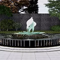 Water Fountain Featuring White Leaf Shaped Sculpture Circular Base Green Plants And Stone Wall